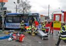 D: Person unter einem Autobus eingeklemmt