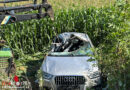 D: Ein Todesopfer bei schwerem Autounfall → verformte Karrosserie mit Frontlader gestreckt